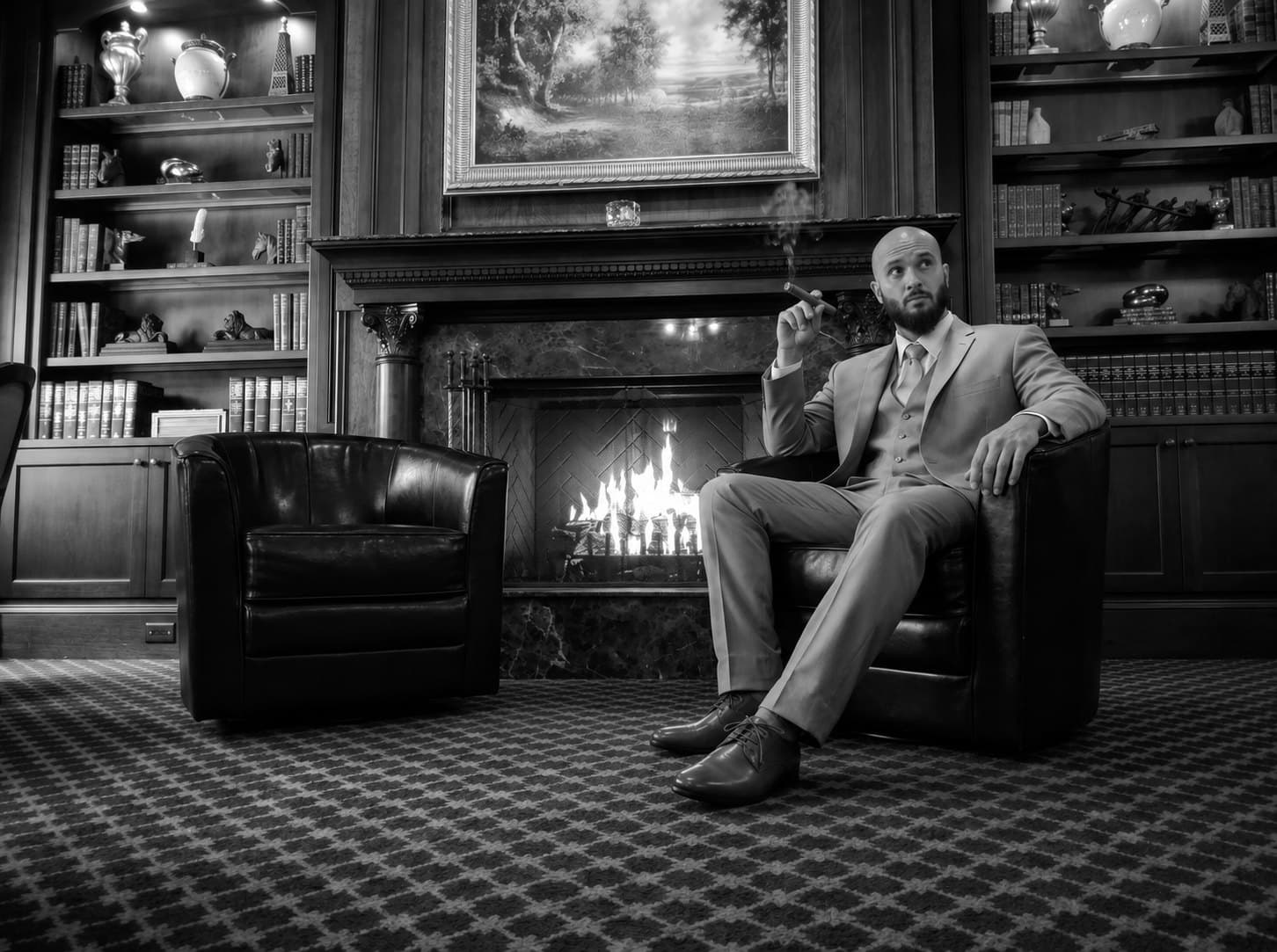 Neb (NebMeta) — photographer and storywriter Neb (NebMeta / @CLOUD_STR1FE) in a suit by a fireplace, black and white